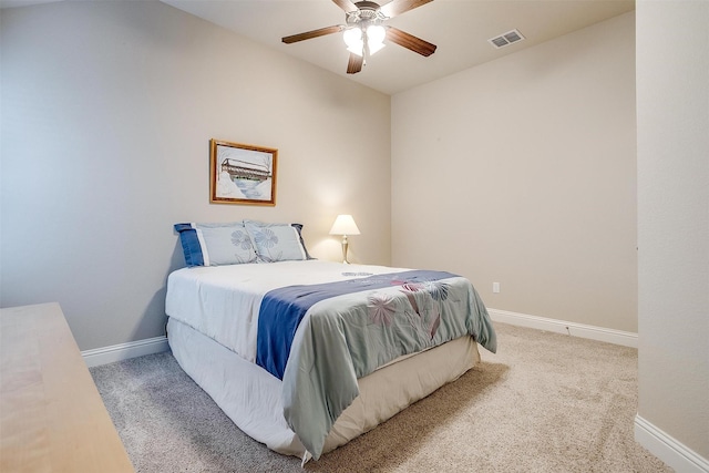 bedroom with a ceiling fan, baseboards, visible vents, and carpet flooring