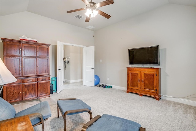 sitting room featuring lofted ceiling, visible vents, ceiling fan, and light carpet