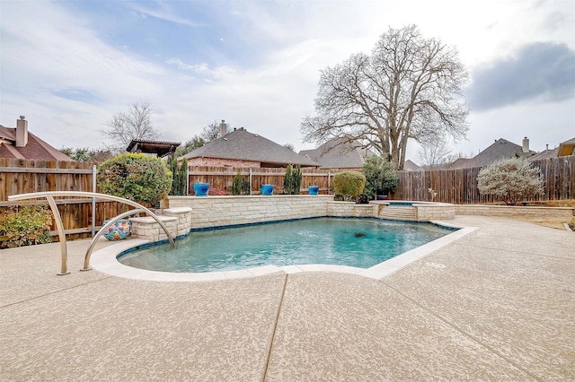 view of swimming pool with a fenced backyard, a patio, a fenced in pool, and an in ground hot tub