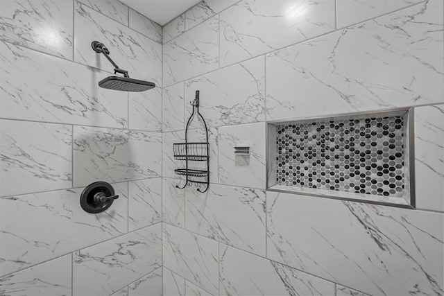 full bath featuring tiled shower