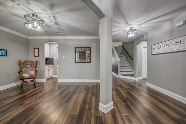 interior space with visible vents, arched walkways, dark wood-style floors, and stairs