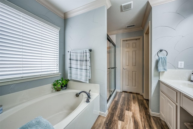 full bathroom with visible vents, a stall shower, ornamental molding, wood finished floors, and a bath