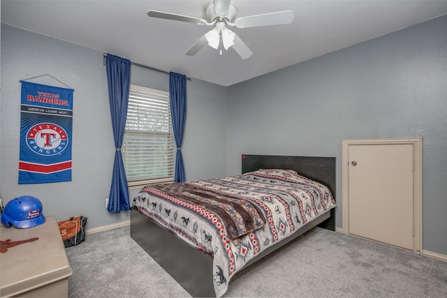 bedroom featuring baseboards, a ceiling fan, and carpet flooring