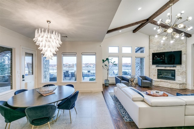 living room with a fireplace, visible vents, an inviting chandelier, beamed ceiling, and baseboards