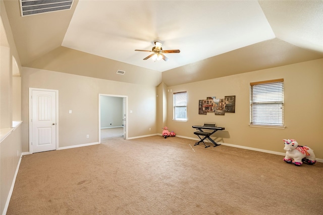 rec room featuring light carpet, baseboards, visible vents, and vaulted ceiling