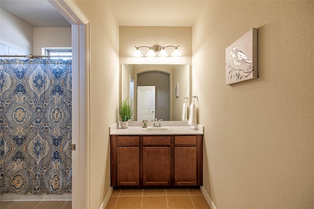 full bathroom with tile patterned flooring, baseboards, vanity, and a shower with shower curtain