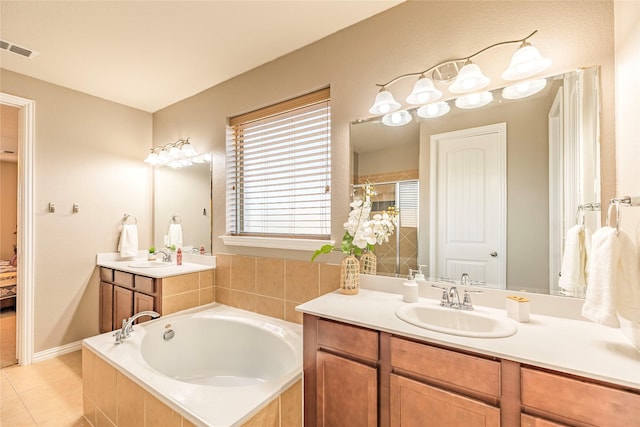 bathroom featuring visible vents, tile patterned flooring, a tile shower, vanity, and a bath