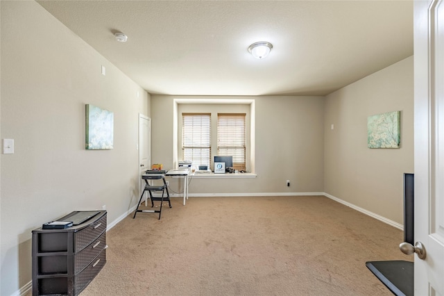 interior space with carpet floors and baseboards