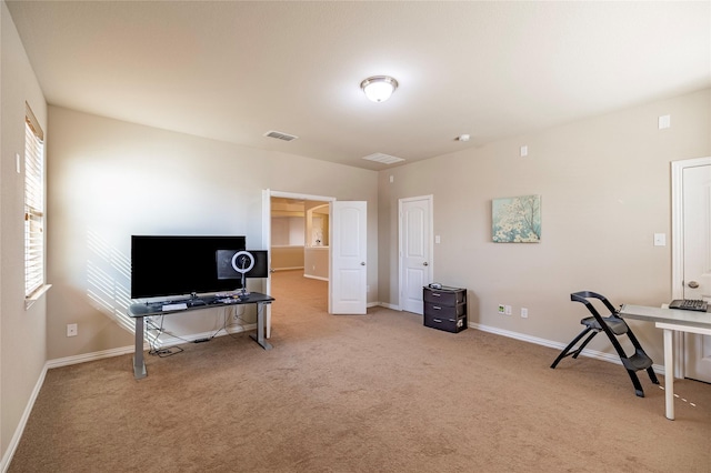 office area with carpet floors, visible vents, and baseboards