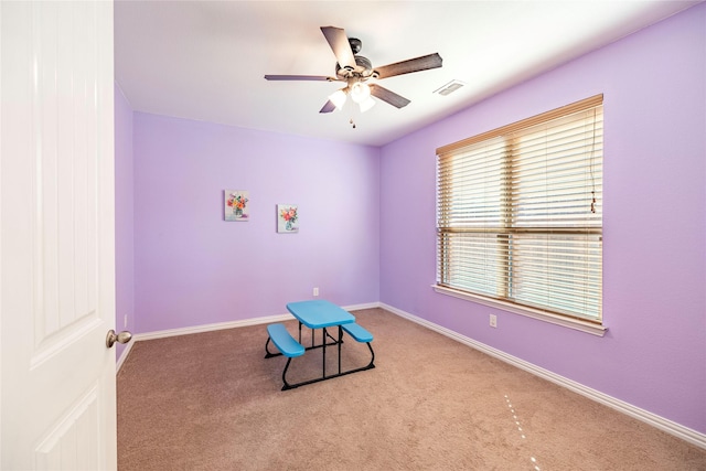 game room featuring a ceiling fan, carpet flooring, visible vents, and baseboards