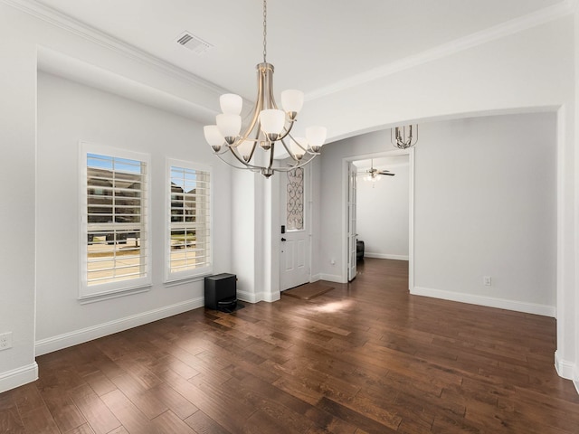 unfurnished dining area with hardwood / wood-style floors, visible vents, and baseboards