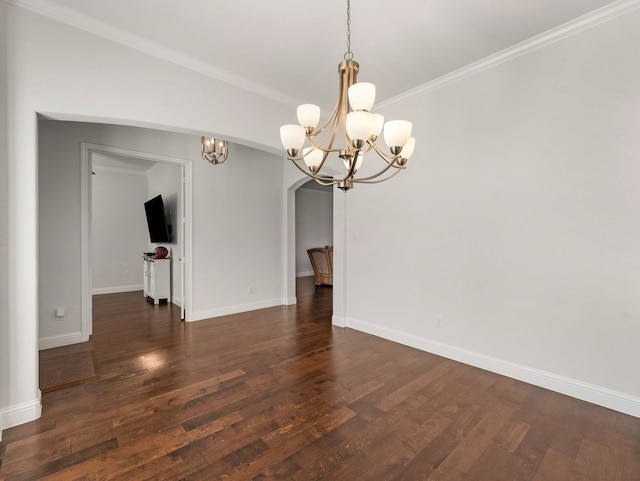 interior space featuring a chandelier, crown molding, dark wood-style flooring, and baseboards