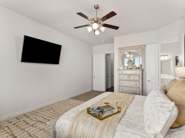 bedroom with ceiling fan, carpet floors, and baseboards