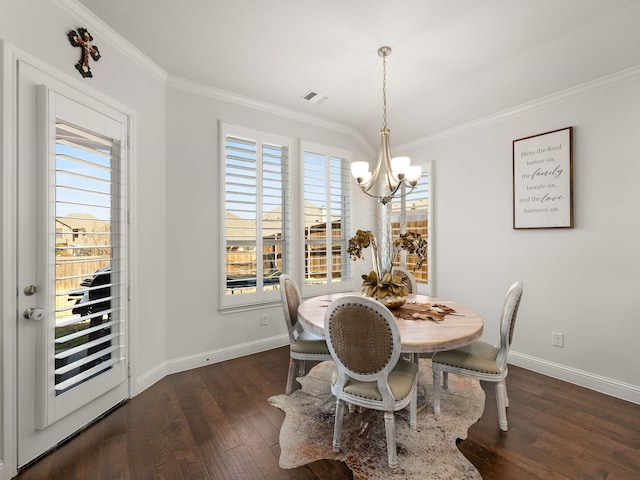 dining room featuring a healthy amount of sunlight, visible vents, a chandelier, and crown molding