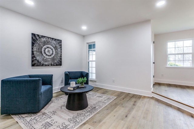 sitting room with recessed lighting, baseboards, and wood finished floors