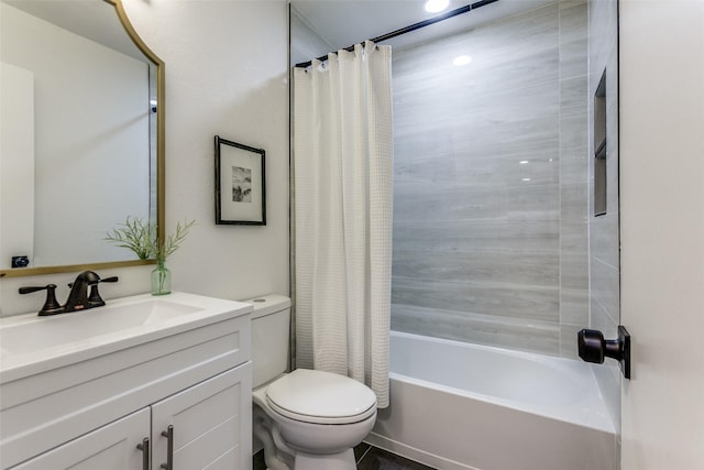 bathroom with vanity, toilet, and shower / bath combo with shower curtain