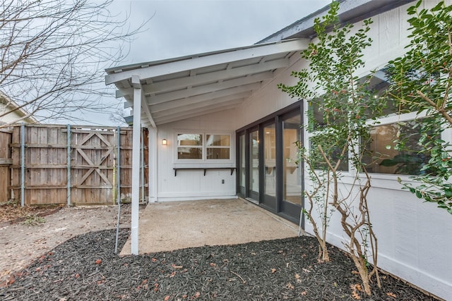 view of patio featuring fence