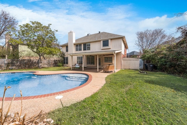 view of swimming pool featuring a yard, a patio, a fenced backyard, and a fenced in pool