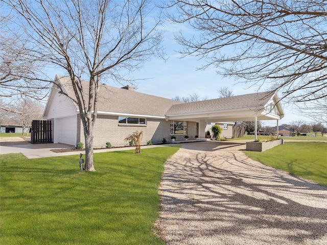 view of front of property with driveway, brick siding, a front lawn, and a shingled roof