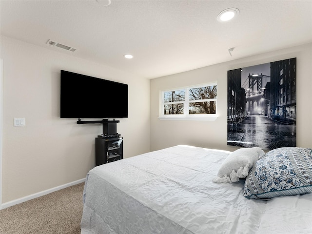 carpeted bedroom featuring baseboards, visible vents, and recessed lighting