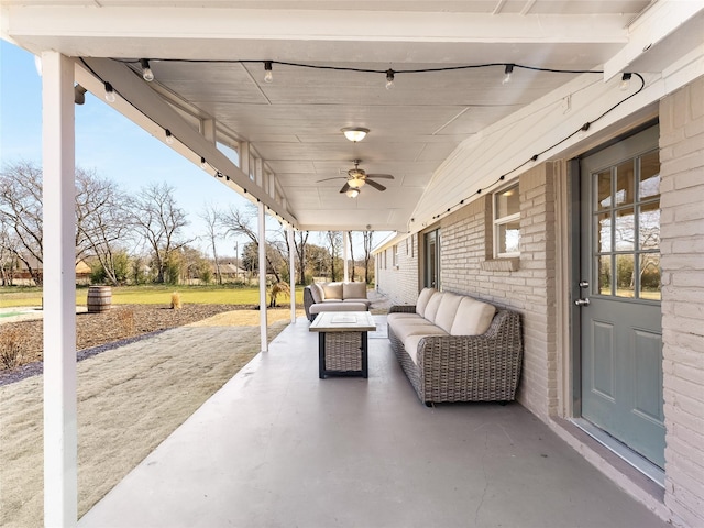 view of patio featuring a ceiling fan and an outdoor living space