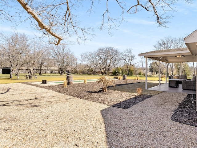 view of yard with outdoor lounge area and a patio