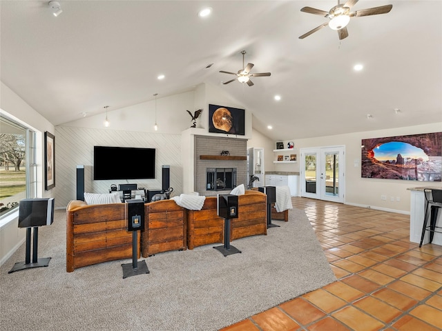 living area featuring a brick fireplace, french doors, tile patterned flooring, and recessed lighting