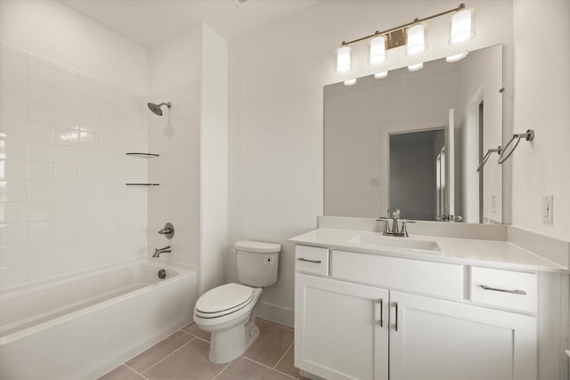 full bathroom with shower / washtub combination, toilet, vanity, baseboards, and tile patterned floors