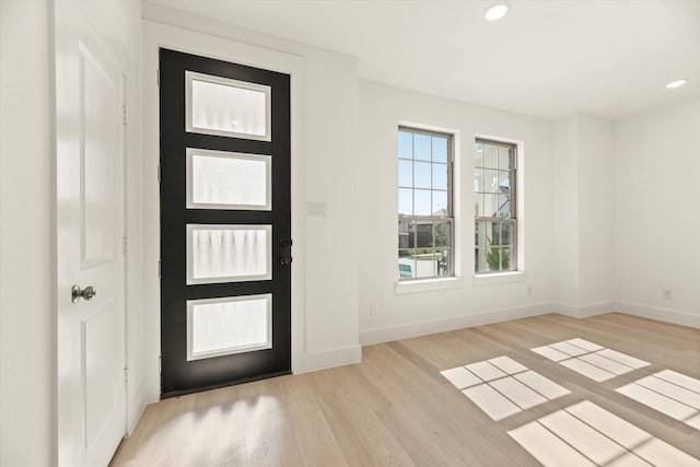 entryway featuring recessed lighting, light wood-style flooring, and baseboards