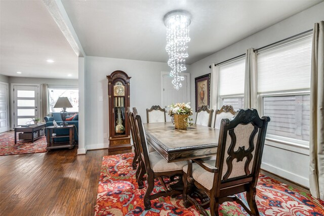 dining area with a notable chandelier, recessed lighting, baseboards, and dark wood-style flooring