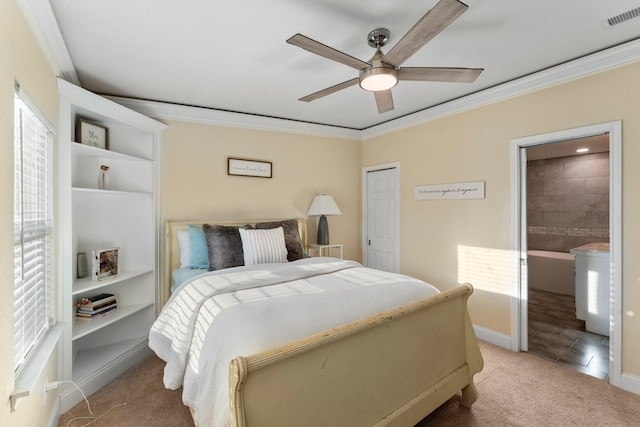 carpeted bedroom with connected bathroom, a ceiling fan, visible vents, a closet, and crown molding