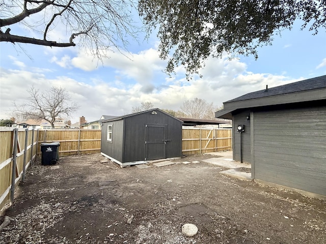 view of shed with a fenced backyard