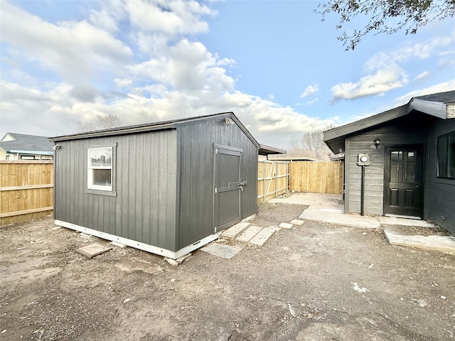 view of shed featuring a fenced backyard