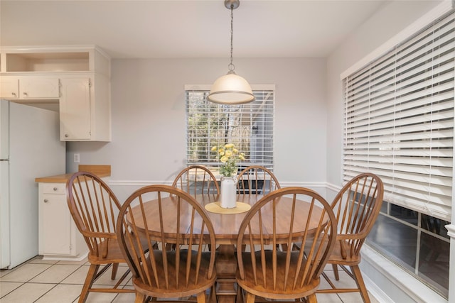 dining area featuring light tile patterned floors