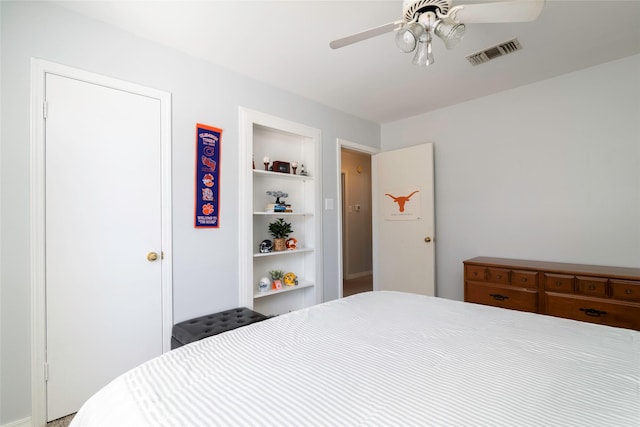 bedroom with visible vents and a ceiling fan