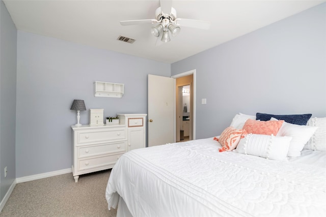 bedroom with light carpet, baseboards, visible vents, and a ceiling fan