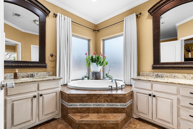 bathroom featuring two vanities, a sink, visible vents, and crown molding