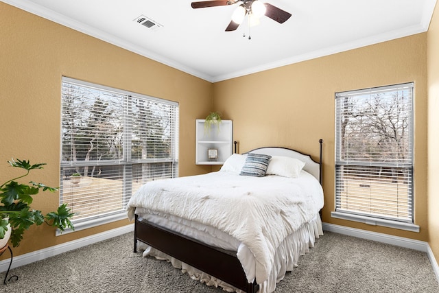 bedroom with baseboards, carpet floors, multiple windows, and crown molding