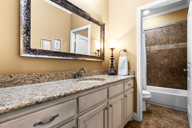 bathroom with toilet, a textured wall, shower / tub combo, and vanity