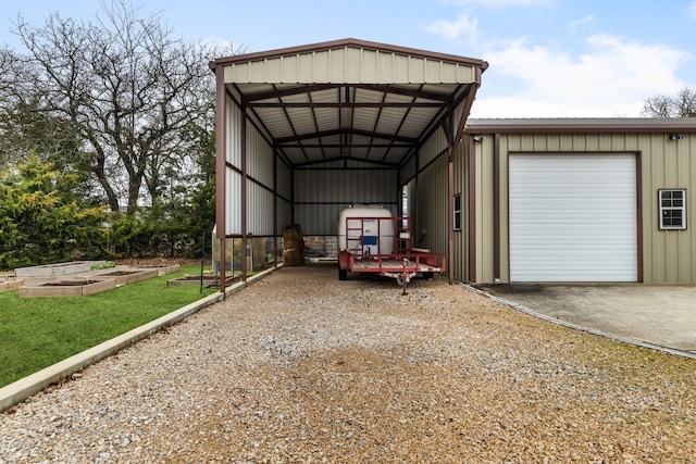 view of vehicle parking featuring driveway and a garden