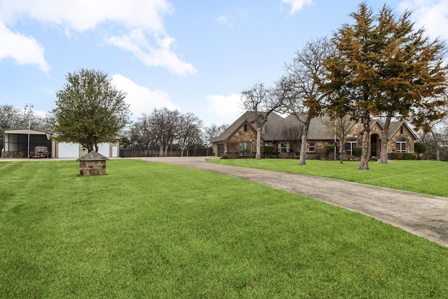 view of property's community featuring a garage and a yard