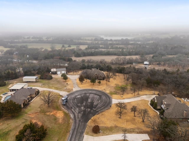 birds eye view of property featuring a rural view