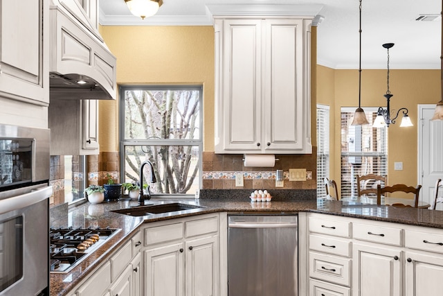 kitchen featuring stainless steel appliances, crown molding, a sink, and visible vents