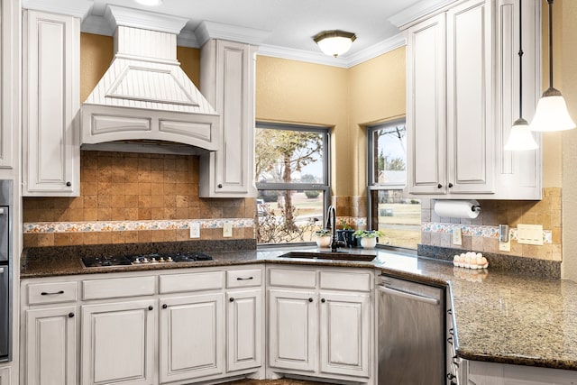 kitchen featuring backsplash, appliances with stainless steel finishes, ornamental molding, a sink, and premium range hood