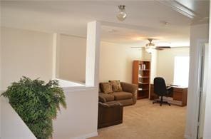 carpeted office with ceiling fan