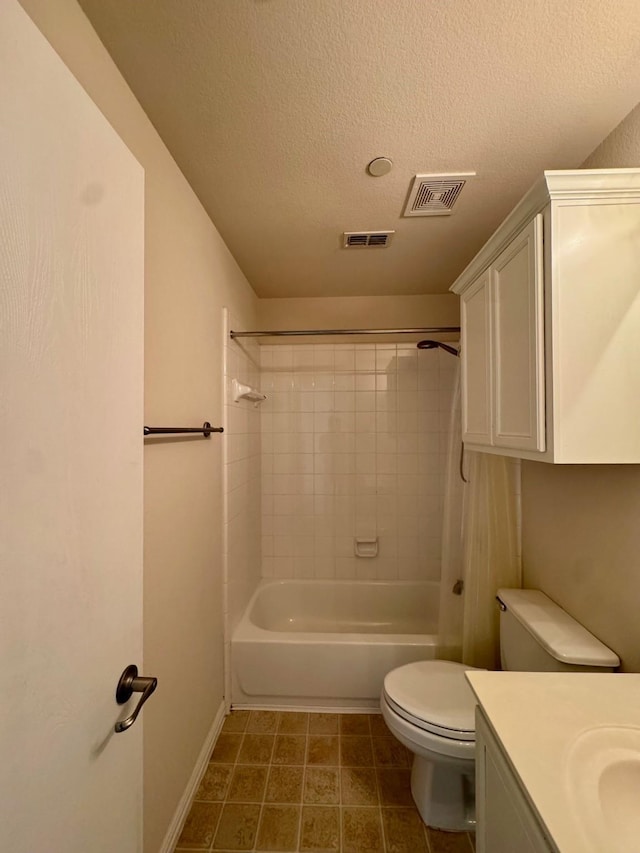 full bathroom featuring toilet, visible vents, a textured ceiling, and vanity