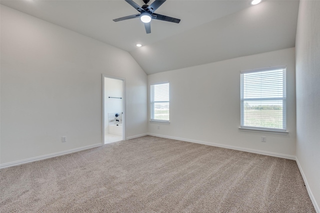 carpeted empty room with vaulted ceiling, recessed lighting, a ceiling fan, and baseboards