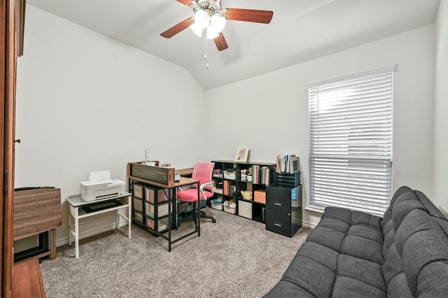 carpeted home office featuring lofted ceiling, a ceiling fan, and baseboards