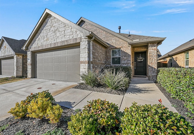 view of front of house with a garage, concrete driveway, and brick siding