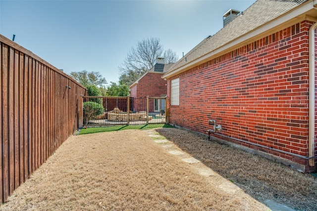 view of yard featuring a fenced backyard